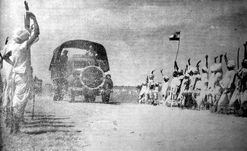An Indian Army motor column is cheered by villagers on its way to Naldurg, Hyderabad.